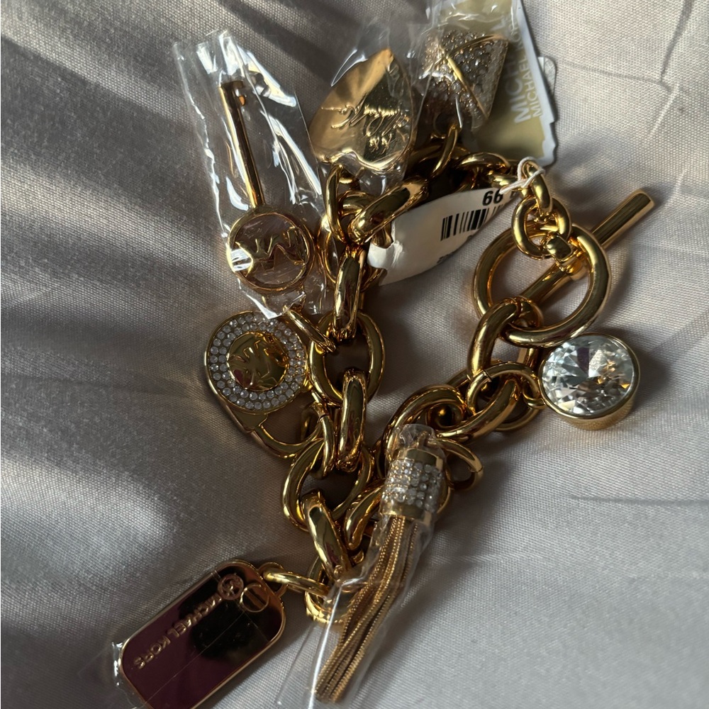 Gold Michael Kors charm bracelet